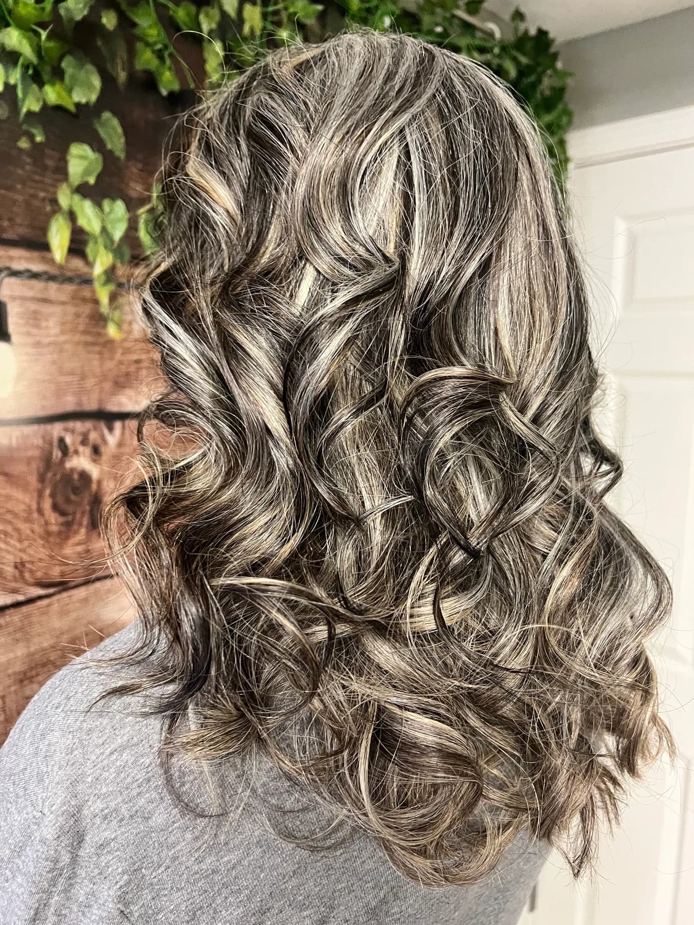 Dimensional gray curls styled at Hair Haven